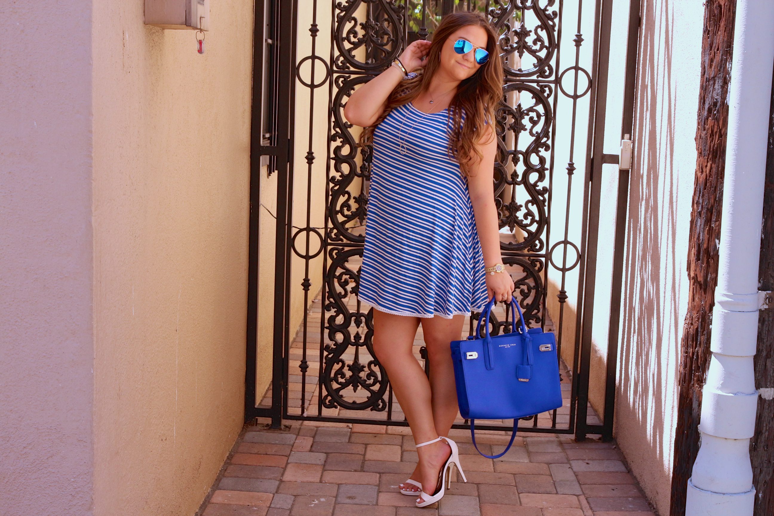 missyonmadison, melissa tierney, fashion blog, fashion blogger, blue satchel, kenneth cole satchel, kenneth cole blue satchel, cobalt blue satchel, white and blue striped dress, striped dress, ami clubwear, ami clubwear striped dress, ray bans, blue aviators, blue ray bans, white ankle strap heels, white ankle strap sandals, steve madden white heels, white ankle strap steve madden sandals, la blogger, fall fashion, how to wear color in the fall, pops of color,
