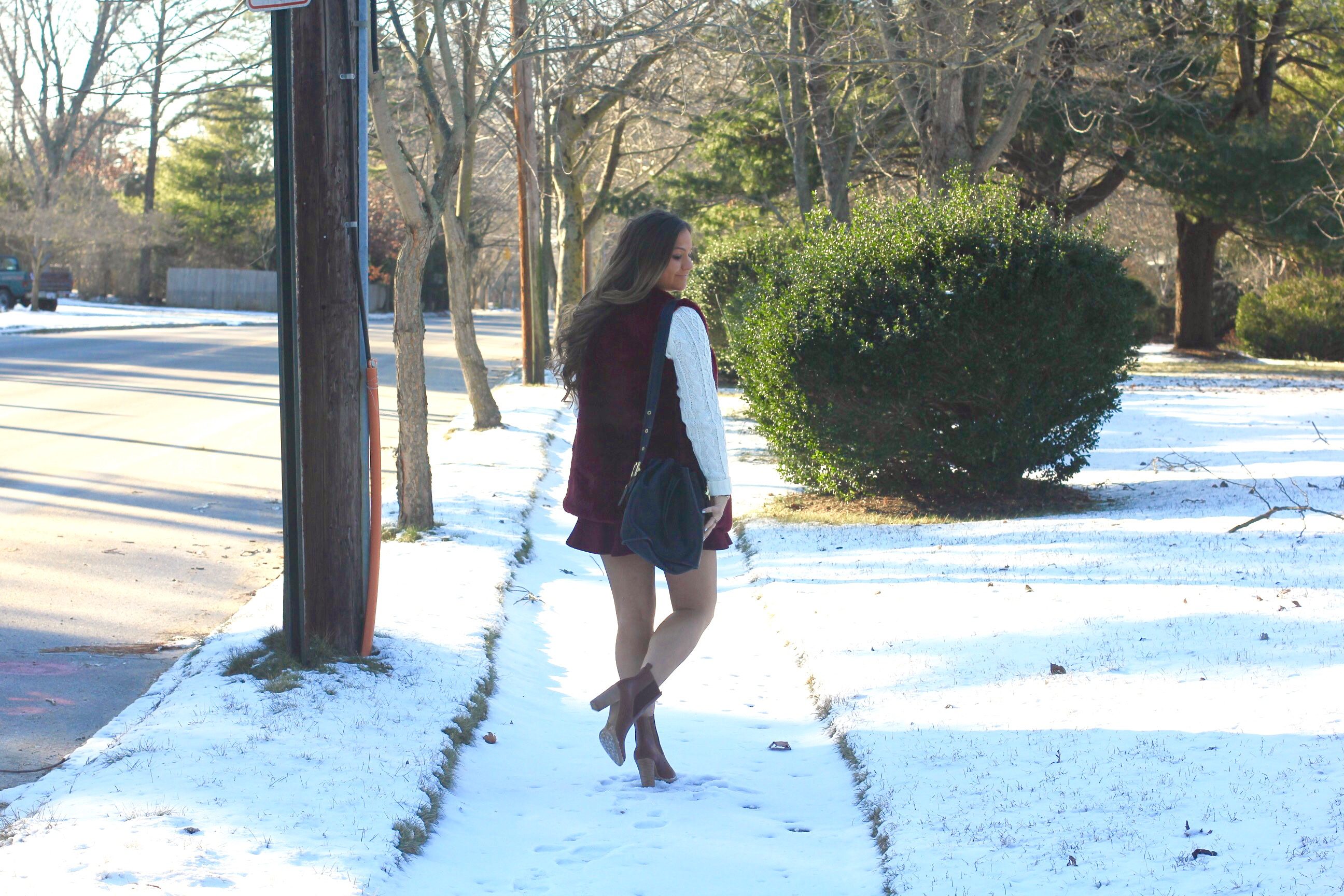 missyonmadison, melissa tierney, la blogger, winter style, ny blizzard, snow day style, tan leather heeled boots, maroon skater skirt, maroon faux fur vest, maroon vest, winter hair style, anne klein watch, black leather bucket bag, heeled ankle boots, white cable knit sweater, womens white cable knit sweater, ny blogger, tbt, throwback thursday, winter hair trends, brunette hair style, snow style, how to wear maroon,