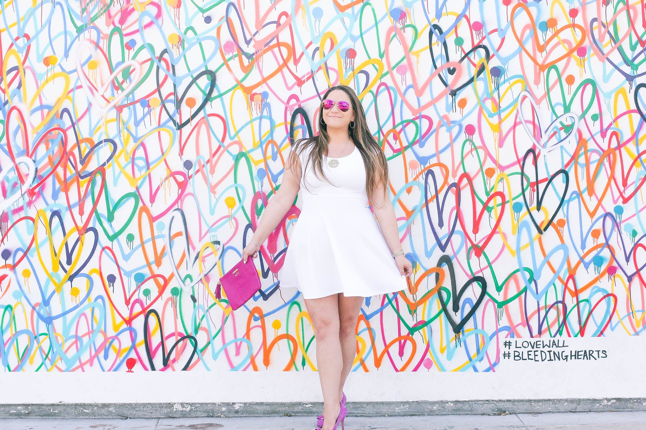 missyonmadison, melissa tierney, missy on madison instagram, pink pumps, pink bow pumps, michael kors heels, fuschia pink pumps, fuschia pumps, white dress, white fit and flare dress, gigi ny, gigi ny magenta clutch, pink clutch, pink ray bans, pink aviators, monogram necklace, heart wall, abbot kinney, venice, heart wall venice, vday, valentines day, valentines day style,