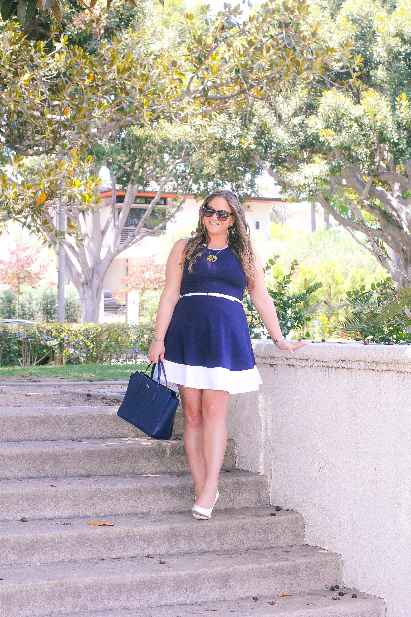 missyonmadison, missy on madison instagram, melissa tierney, la blogger, fashion blogger, style blogger, beverly hills, beverly hills style, navy aline dress, navy blue a line dress, navy blue and white a line dress, nautical dress, lacoste tote bag, lacoste satchel, navy lacoste bag, monogram necklace, black wayfarer sunglasses, white pointed toe pumps, white pumps, spring style, what to wear for an interview, spring style for work, office style, blue a line dress, white skinny belt,