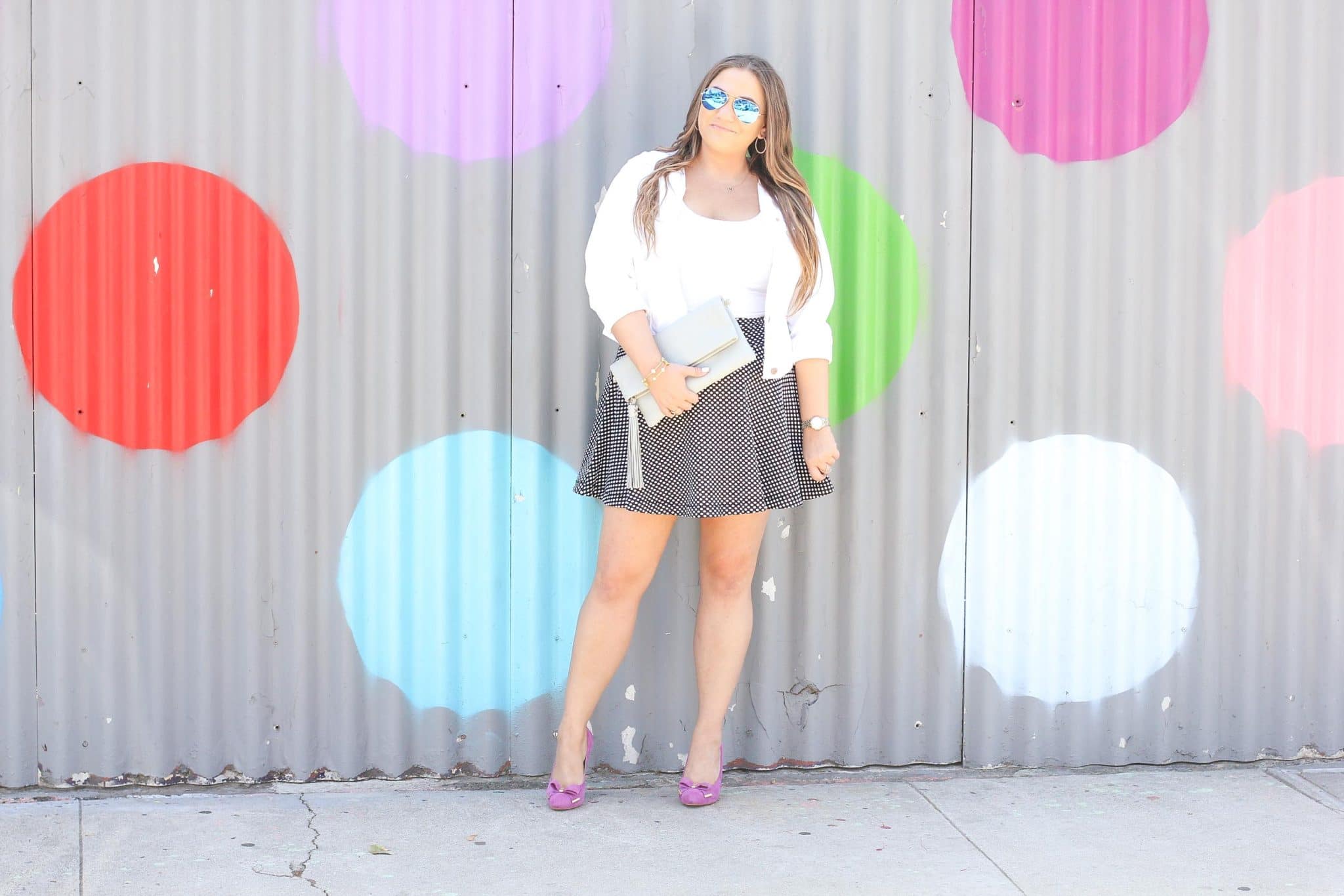 missyonmadison, polka dot skirt, polka dot wall, la blogger, fall style, fall fashion, fall blogger, currently wearing, melissa tierney, melissa tierney instagram, pink pumps, gigi new york, gigi new york clutch, fuschia pumps, pink bow pumps, michael kors heels, michael kors pumps, polka dot skirt, white moto jacket, white crop top, white short sleeve crop top, how to style polka dots,