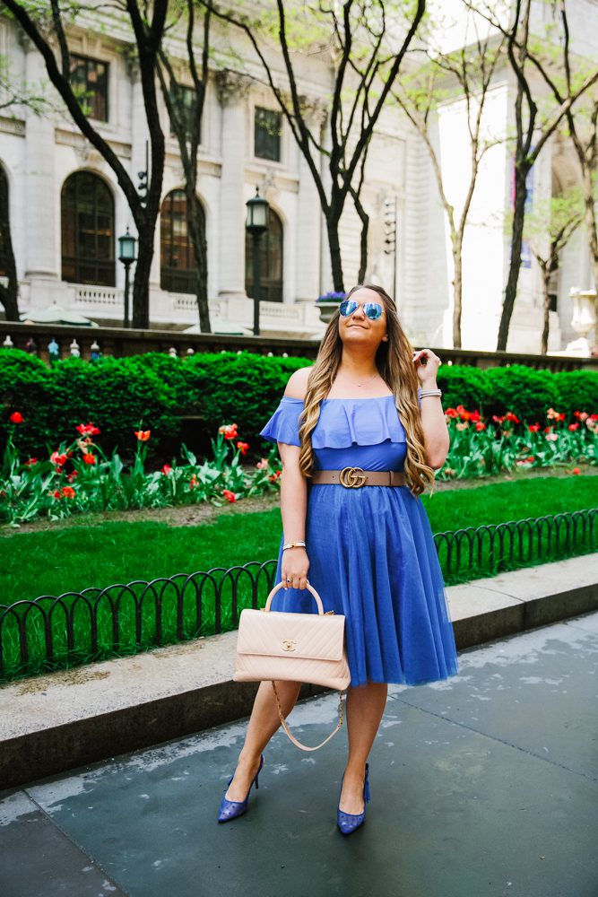 missyonmadison, missyonmadison blog, missyonmadison blogger, missyonmadison instagram, la blogger, outfit ideas, outfit inspo, blue pumps, blue tulle skirt, blue skirt, blue off the shoulder bodysuit, chanel bag, beige chanel bag, blue raybans, fashion blogger, style blog, style blogger, nypl, carrie bradshaw outfit, chanel tan satchel, outfit inspiration, adding color to your wardrobe, pop of color,
